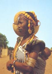 Young Peulh girl with her baby