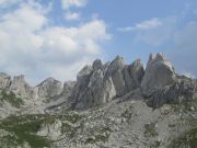 More twisted rock, with Zupci, Durmitor`s `Teeth` in the background More twisted rock, with Zupci, Durmitor`s `Teeth` in the background