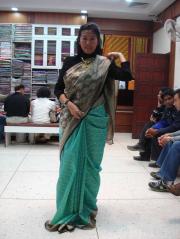 A happy tourist trying the sarees! And yes...she bought it! A happy tourist trying the sarees! And yes...she bought it!
