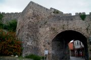 Banja Luka Gate and little houses on their last legs on the other side.