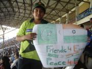 message for harmOny between India n Pakistan-- a kid with a poster at the Gaddaffi stadium, Karachi message for harmOny between India n Pakistan-- a kid with a poster at the Gaddaffi stadium, Karachi