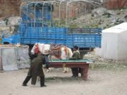 Tibetans, their horse, a truck and a pool table.