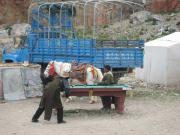 Tibetans, their horse, a truck and a pool table. Tibetans, their horse, a truck and a pool table.