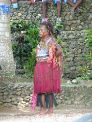 An old woman performing at a wedding ceremony