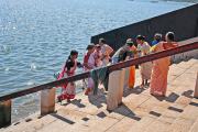 the devotees going down the ghats, to perform their ablutions. the devotees going down the ghats, to perform their ablutions.