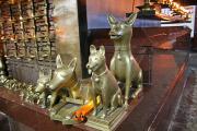 Inside is a wooden shrine guarded by bronze temple dogs. Dogs are considered sacred. Inside is a wooden shrine guarded by bronze temple dogs. Dogs are considered sacred.