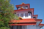The tiered roof is supported by pillars and decorated with elephants. The tiered roof is supported by pillars and decorated with elephants.