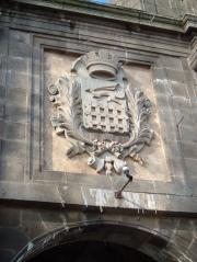 The town crest above one of the massive gates