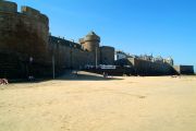 The beach by the old town walls The beach by the old town walls