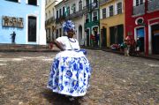 A woman dressed in traditional Salvadorian dress, posing for BRL5.