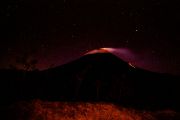 Smoking and lava flowing the Arenal Volcano - lava flowing on the right Smoking and lava flowing the Arenal Volcano - lava flowing on the right