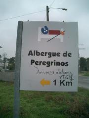 Announcement of a shelter for pilgrims with the yellow arrow Announcement of a shelter for pilgrims with the yellow arrow