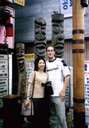 A couple of friends in front of a shop in Insa-dong A couple of friends in front of a shop in Insa-dong