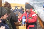 Hot chocolate and cinnamon rolls on the whale watching cruise