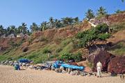 The beach is backed by a sheer cliff wall. The beach is backed by a sheer cliff wall.