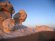 Formations turned rose at Sunrise, Here our family of three watch the setting moon.