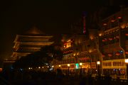 Shops and the Drum Tower in the background at night